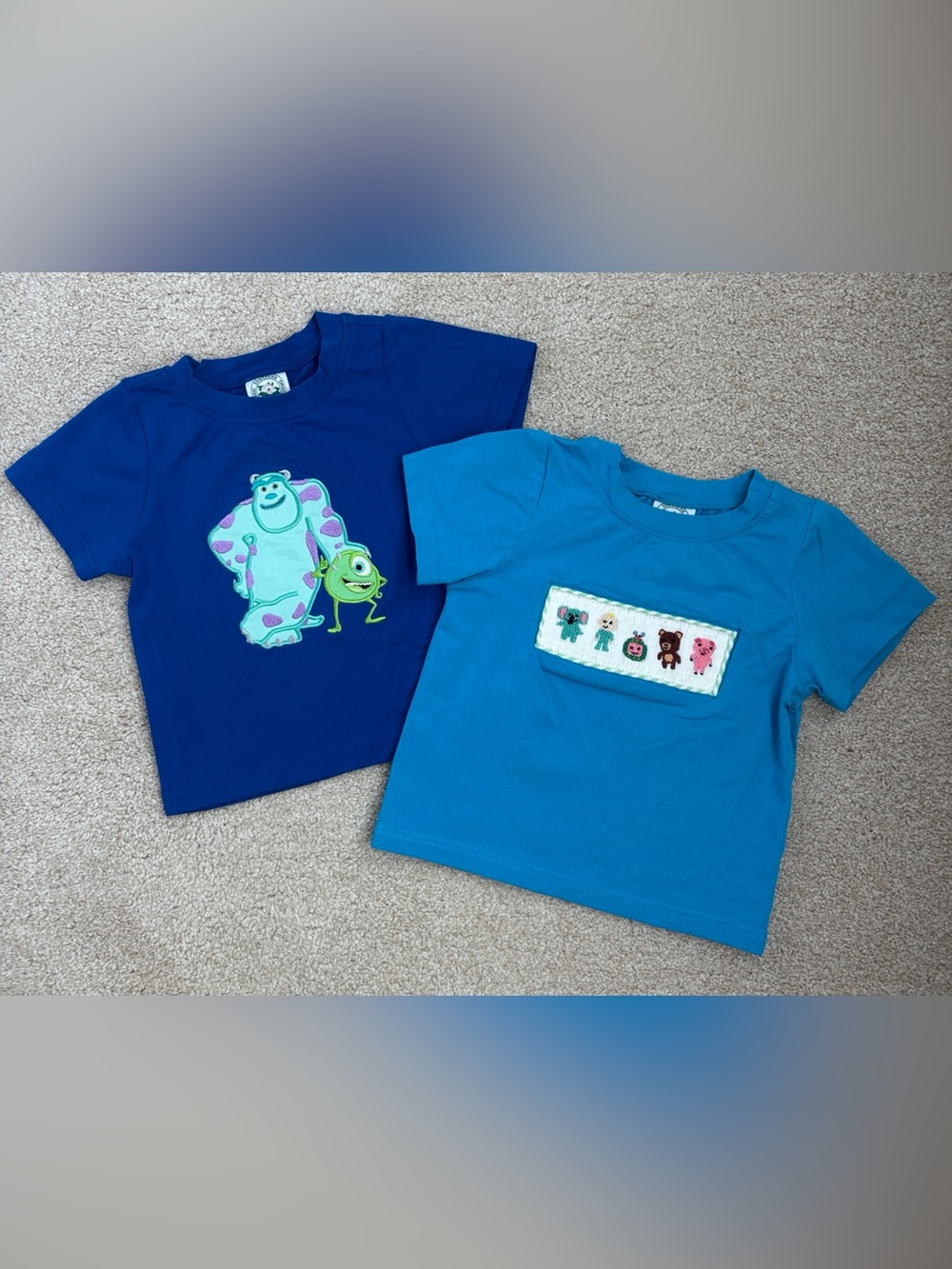 Pair of 18mo. Classics Southern Smocks shirts, smocked CocoMelon & Monsters Inc.